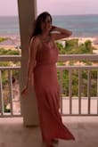 I'm not a "pink" kinda girl, but this rusty rose color is so pretty! The material is clingy and thinner, so it definitely shows some lumps and bumps, so I wore spanx for a smoother look. I could easily wear a strapless bra with it. Fun beachy dress with a sexy slit! - Mackenzie S.