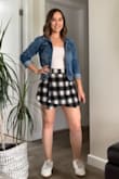 This skirt is even cuter in person and true to size. Some things to consider: the material is just a little itchy, but tucking your shirt into it will solve this problem. There is also zero elasticity in the waist or legs, so you may not want to sit in this skort for several hours. For walking around and looking cute, however, this skort is perfection! - Kacie H.