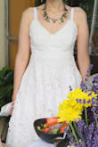 This is a great dress! I wore it for my bridal shower. It can be styled lots of ways and the lining works well enough to not need a slip, probably because there's also a crinoline. I found the chest runs small (I wear a 28E), but if I would have sized up, the waist would have been too big. I still think it looked nice on! I loved the different patterns on the flower petals in the lace. It makes the dress interesting! - Stephanie V.
