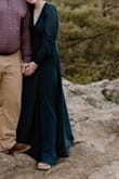 Loved this dress! Wore it for my engagement photos, I received so many compliments as we were walking through a state park, and the compliments after I got my photos back were unreal! I can't wait to wear it for upcoming weddings and events. I was long on me, but a pair of wedges helped. It flowed in the wind so beautifully for photos. It did wrinkle a bit during the hour drive but you couldn't tell. The bust fit well, but it was a bit revealing. Can't wait to wear again! - Catie H.