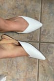 I am a size 8 in shoes and that's exactly what I got.. it was a little tight around my toes but I think they just needed to be broken in, but they are the cutest flats ever! You can definitely pair these with mainly anything. The back strap does have a good grip on the back ankle so it does not fall off easily at all! I will be wearing these at my work all the time! - Jasmine S.