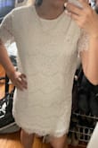 This type of dress is pretty hard to get the fit exactly right without getting it tailored. It fits pretty loosely all throughout, but I was worried that a small would've been too tight on my waist. It's a very elegant and chic dress, definitely worth getting tailored to fit my body perfectly. The lace isn't itchy at all! - Victoria C.