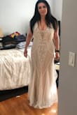 Absolutely stunning. Using this as my wedding dress but I need a size smaller. It's made very nicely and it's exactly what I wanted. Simple and elegant and very comfortable to wear. - Tara L.