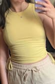 The yellow in the image when I ordered it and as I'm writing this is much brighter than the actual yellow of the top. It's much more muted and basically a light mustard yellow. This top also runs too small- it basically felt like an Xsmall. I've rarely had any issues with purchases from Lulus being displayed in the wrong color so this is pretty surprising. The top itself is cute but I will be returning or exchanging this one for another color and larger size! - Rebecca S.