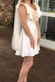 This dress is SO flattering! I love it so much! I wore it for my bachelorette party and plan to wear it again for our rehearsal dinner because it's just so pretty and fun! It fits me perfectly. Not tight but not loose either. The length is good, it's not super duper short on me. Although, it might be on a taller person. You can't wear a regularly bra with it because the back is too low, but the ruffles cover up your boobs anyway. I am not packing up top so I didn't really need to worry about it and I just wore some of the silicone cover ups from Hollywood Fashion Secrets. Mostly just so I would feel like I had some kind of coverage. You could totally do one of those sticky bras if you needed more support though. - Lauren R.
