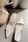 I was already in love with the look of these online, but they stun even harder in person. Beautiful, soft ivory just as pictured. The wood heel is beautiful and lightweight. Comfortable as well. I ordered a 5.5 and they're perfect. I wear both 5.5 & 6 in shoes, and a 6 would have been a bit too big leaving too much space behind my heel. I would recommend if you're in between sizes, size down. - Sarah C.
