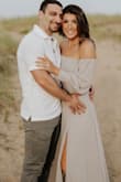 I originally ordered this dress in a medium but ended up having to exchange it for a small. It is more beautiful in person and was the perfect dress for my engagement pictures! - Brianna