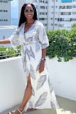 This dress was awesome. The material isn't stretchy, so get your normal size. It is long however I'm 5 '6" medium  and it didn't drag the ground. The waist has an elastic band that does stretch so no worries on it being too tight. - Crystal M.