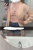 It's meant to be a little baggy. Ties really cute! And this photo doesn't do it justice! Sooo nice for a chilly boat ride back from the beach or a cute cover up for lunch at the beach. Love it! - Emma A.