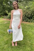 Wore this for a civil wedding ceremony outside on a 90-degree day and it was great! It was light and flowy but still thick enough that it wasn't see-through. The open back is beautiful and the bow adds a cute touch. I ordered a size small, it fit somewhat tight, so if your in between sizes I would order up. - Molly W.