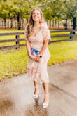 This dress is so pretty and feminine! It was perfect to wear to my friends wedding and I got so many compliments. I would've gotten a large but reviews said it runs a little small so I got the XL to be safe. It fits fine but a little big and loose on me, however it's not noticeable...just something I felt! Otherwise it's perfect :) - Adriana F.