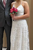It was a little long on me, I wore 3 inch heels but beside that it fit perfect! The back was beautiful, I couldn't have asked for a better dress for my last minute wedding. - Kayleigh M.