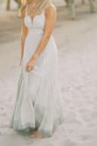 Got this dress for engagement photos on the beach. The open back is my favorite part but it's also a great material, a soft sage color and oh so comfy. It's not too heavy of a dress either! **it looks white in pics bc of the edit, but it's a soft sage green** - Sabrina T.