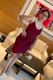 The dress is really sexy and fits very well, the color is very true to the one shown in the pics with a deep wine red. The dress does run up a bit during sitting on the chair or a couch from the front but doesn't at all while walking and goes well with a pair of heels. The cleavage is just perfect and can be worn be worn without a bra but goes well with a strapless bra. Would wanna try and buy this in another color as well ! - Prashant M.