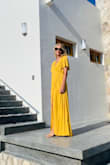 Beautiful dress with a vibrant color. I'm 5'8 and wore heels and it was still hitting the floor. I should have hemmed it. You can wear a regular bra with it which was nice. Got lots of compliments on it. - Jasmine P.