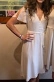 I wore this as my graduation dress! I received many compliments on it and cannot wait to have a reason to wear it again. Unfortunately it rained all day on my graduation and it had to be outside - hence the reason I wore crocs with it. I originally ordered a small and I ended up receiving the wrong dress and could not exchange for the same size because the small was sold out. With less than a week before my graduation I needed something so I ordered it in an XS and was so glad that I did - it fit perfectly! - Alexis S.