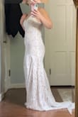 It fits perfect!! It's a little long but I am shorter so I expected that! Can't wait to wear this on my elopement day - Jessica K.
