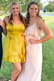 I loved the fabric, seemed high quality and had a great sheen to it! I got a medium, which I would normally order. It was a little big through the bust, so I just wore a strapless bra and it was fine! Perfect for a wedding guest dress! - Savanna H.