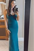The color and cut of this dress is soooo flattering. It is tight enough to feel like it holds you in a little but stretchy enough to be comfortable. I would say the material is on the thicker side, which made it a little hot for a July wedding, but I prefer the thicker material because it's smoothes out any "imperfections" better than a thinner material would. I did have to wear a bra with this but the placement of the back cut out worked perfect with one of my bras. - Alexandra N.