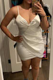 It hugs my body perfectly. I got a medium size and I felt it runs a little small, I would be fine with a large. But since my wedding is about to happen I have no time to change. Gonna wear this to my after party Vegas Wedding. It's beautiful! - Caroline S.