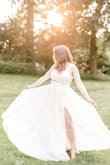 I bought this dress as an option for my wedding and although I went with a different dress for the ceremony, I kept this one to use for pictures. And WOW was it the right choice!! I wore it this week for our engagement shoot and it. Was. Perfect. My photographer was obsessed with it and so am I! The straps and coverage are enough that I could wear my everyday bra, which was great for photos in the park where I wanted to do an outfit change. I probably could have gone down a size as well, but there isn't a lot of stretch in the bust so I decided not to exchange it. Overall, 5/5, it's beautiful and comfortable and so fun!! - Amanda K.
