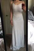 I love this dress! It is beautiful/simple/classy with a touch of sparkle. The actual form fit is perfect but the length is much too long. If you are tall, this is the dress for you. Unfortunately, even in heels, the dress fell past my toes by several inches. I was sad to return it. - Megan K.