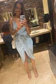I love this dress! I couldn't move my fingers fast enough when it was restocked. I ordered a M and a L and decided to keep the M because it hugged my frame more. The dress stretches so you can go down a size. I'll definitely be purchasing this in other colors once they restock them. - Tiara D.
