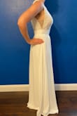 I was looking for anniversary dress for beach pictures. The skirt is 3 layers, but still floats around and could probably work well for pictures to have it trail behind a bit. I appreciate that this dress could've worked with 2-3 inch heels, I only needed a normal bra, and no part of the dress was see through at all. (I ultimately went with a different dress because this one was just a little too heavy for the standing under the hot sun/running through sand). - Maranda B.