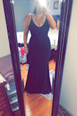 I purchased this in two sizes for a wedding. I ended up wearing the M, as I ended up liking the tighter fit more and didn't find the need to wear a bra with it. Of course, it was too long, however with my heels it was a good length. The material was extremely forgiving and fit like a glove. I got so many compliments on this dress. I tried to order the same dress in a different color for another wedding, but there is none in my size. Well worth it and highly recommend! - Stephanie G.