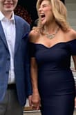 I wore this to my nieces wedding in July. The fit is true to size. The material is supportive and gives a slight "hug" but in all of the right places! I did wear Spanx under it for soothing out any lumps and bumps. I received many compliments but more importantly I felt good in this dress. - Christine S.