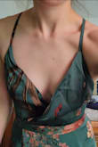 I really like the material of this dress, which is silky and medium weight. It feels premium enough that it won't pill immediately and the print is crisp and vibrant, though a bit darker in person than in the photos here. I sized down based on what others reviewed and got the XS and it was perfect for me. I do have a smaller bust so I was happy that the straps were adjustable, though I do feel like the straps seem a bit unsubstantial and thin compared to the quality of the rest of the dress. My only other complaint is that I wish this was lined with some cups or was a bit thicker in the bust and that there was a little snap to keep the wrap from falling down in the front. No nip slip for me, thankfully, but I may add a snap just in case!

I will also mention that these dresses arrived with a really strong strange smell, just in case that's something that really bothers you! - Hannah P.