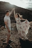 Bought this dress for my engagement photo's and they turned out absolutely stunning! Since I am short, I had to wear heels because I didn't want to get the dress hemmed. There is a button at the bust, but I wasn't able to snap it because my bust was too large, so I just sewed a little stich to keep it closed. Probably could have ordered a medium to fit my bust better. Can definitely wear this dress to other functions! - Jenna C.