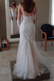 Absolutely in love with this dress!!! Fits almost perfectly! I only had to take in the back darts and hem the dress. It was about 5" too long in the front, but worked out great as the seamstress was able to create a sweep train in the back! I walk and dance perfectly fine as the style is a trumpet dress. I literally can't get over how beautiful this dress is on me and more amazed at the price I paid for it! The quality of material and workmanship is astounding!! - Stephanie L.