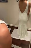 Dress fit perfect, as my normal lulus size is XS. The front is beautiful and clean cut. The back has the nice buttons and if I would have picked this as my wedding dress I would've added an illusion back of clear mesh and added buttons running down my entire back. The only weird part was the back/bunched up mermaid part but I'm sure the more I would've looked at it, the more I would've gotten use to it. I'm 5'1 wearing 3-4in heals and it is still too long but expect that with ALL lulus dresses if you're short. 
Excuse me standing on paper, as I was trying to keep the dresses clean from any cat hair on the ground. - Nicole T.