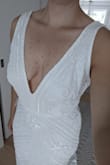 The dress is beautiful and not too heavy even though it is fully beaded. The Large was too big on me everywhere. - Christie S.