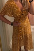 True to size and has a flattering fit! Wearing a size small. - Kelcie J.