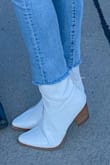 I'm normally between a 9.5 and 10. Usually size 10 is too wide but it fit perfectly. They're a true bright white color. - Michelle H.