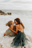 I ordered this dress for a beach photoshoot with my fiancée and it was even more perfect in person than the photos!! I will say the dress ran pretty long on me, but I am also 5'1 so I expected it to be. I cut off about 4-5 inches so it can perfectly touch the ground barefoot since we were running around in the water and sand. Seriously cannot recommend this dress enough!! If you're debating between sizes though, I'd size down since it does run a little large. - Jackie C.