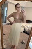 The skirt is definitely cream, so don't get your hopes up that it's a white-ish cream, it's just a yellow-y cream color. Also, the material is pretty stiff and a little noisy. Doesn't have as much movement as it looks to have in the photo. It's really not a terrible skirt, it's just not for me.
Sizing: I usually wear a medium but sometimes can go down to a small in skirts, but this medium was loose on me. I'm not sure I'd trust going down to a size small, but it did just feel loose around the waist.
I am returning it. - Shaelyn F.