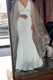 I originally ordered it thinking it could be for the rehearsal dinner, but no other dress has fit me so perfectly, comfortably and beautifully that I am actually wearing this dress on my wedding day! Great quality and very slimming look. Love. Love. LOVE! Attached is a photo BEFORE alterations. - Hyelee W.