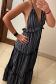 Loved the low back and halter style. Very heavy material, which was perfect for a cool night on vacation. I wore flats and it was a little long, but not so bad that I couldn't walk. Plenty of room. I can be a small or medium in dresses and I definitely could have gotten an XS. - Victoria D.