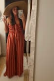 I bought this for my honeymoon and loved it! It does run a bit big so I sized down to a L. I usually size up for the length but this did fit wear flats. loved this and would highly recommend. - Alex H.