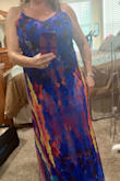 This dress has zero give. I wish there was a little stretch. The under skirt is short and the dress is shear. It's gorgeous and low maintenance. I do need a new more shear bra. Perfect for family beach photos, as well as fun outings. I may invest in a little tailoring in the straps. The length was ok with shoes. This would make a good dress to roll and and use for travel. - Trisha E.