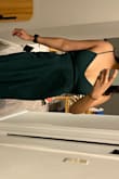 I love the emerald green color of the dress and how flowy it is at the bottom. The band around the chest is sort of tight so if you have a bigger chest, I would size up! - Aditi K.