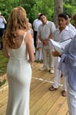 I wore this dress for my back yard wedding and it was perfect! I received so many compliments on it and how elegant it was. It was very comfortable. The material is pretty thick and stretchy. I ordered both an XS and S and wound up going with the XS for a tighter fit. It it a little long, I'm 5'7" and was stepping on the dress a bit (I wore flats) but it worked out fine. If you're shorter you might need to get the dress hemmed! - Emily H.