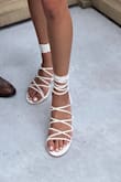 I bought these shoes for a wedding. They were super comfortable, enough for me to walk and dance around all night. It can be hard to tie them up in a good way though to make sure they're not too loose or too tight. 
I usually am somewhere between and size 8 or 8.5 but for these, I went with the 8.5 because the soles of the 8 were just a teensy bit too small. They got a bit dirty while at the ceremony but were very easy to clean off! - Isabel D.