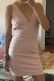 This dress was so cute and would be great for so many different occasions! Unfortunately I had to return because it was too big and the XS were all out of stock. The top was way too loose on me. Everything else fit okay but an XS definitely would have been better 
The material is comfy and stretchy though so you can probably size down pretty easily if needed. Also the back is great for a little bit of a sexy touch. It's a great length too to not be too revealing.
Would definitely size down though if you're between sizes or small chested like me! - Isabel D.