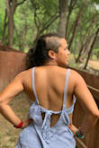 I got lots of compliments when wearing this blouse, it's perfect for summer and gets along very well with shorts or skirts, I love the back and the side cuts. I'd say it's sexy without being vulgar. - Caren C.