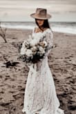 This is dress absolutely gorgeous! We had a vow renewal on the beach and this dress couldn't be more perfect. I'm 4'11 so it was long for me, but since we were barefoot on the beach it didn't bother me. I did alter the back of the dress, I bought it with the intention to do so. - Natashia A.