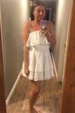 This dress is beautiful, it's so flattering. There is a bit of gel on the top to keep it in place. The fabric is so nice, it's thick enough that it's not see through. - Lila B.